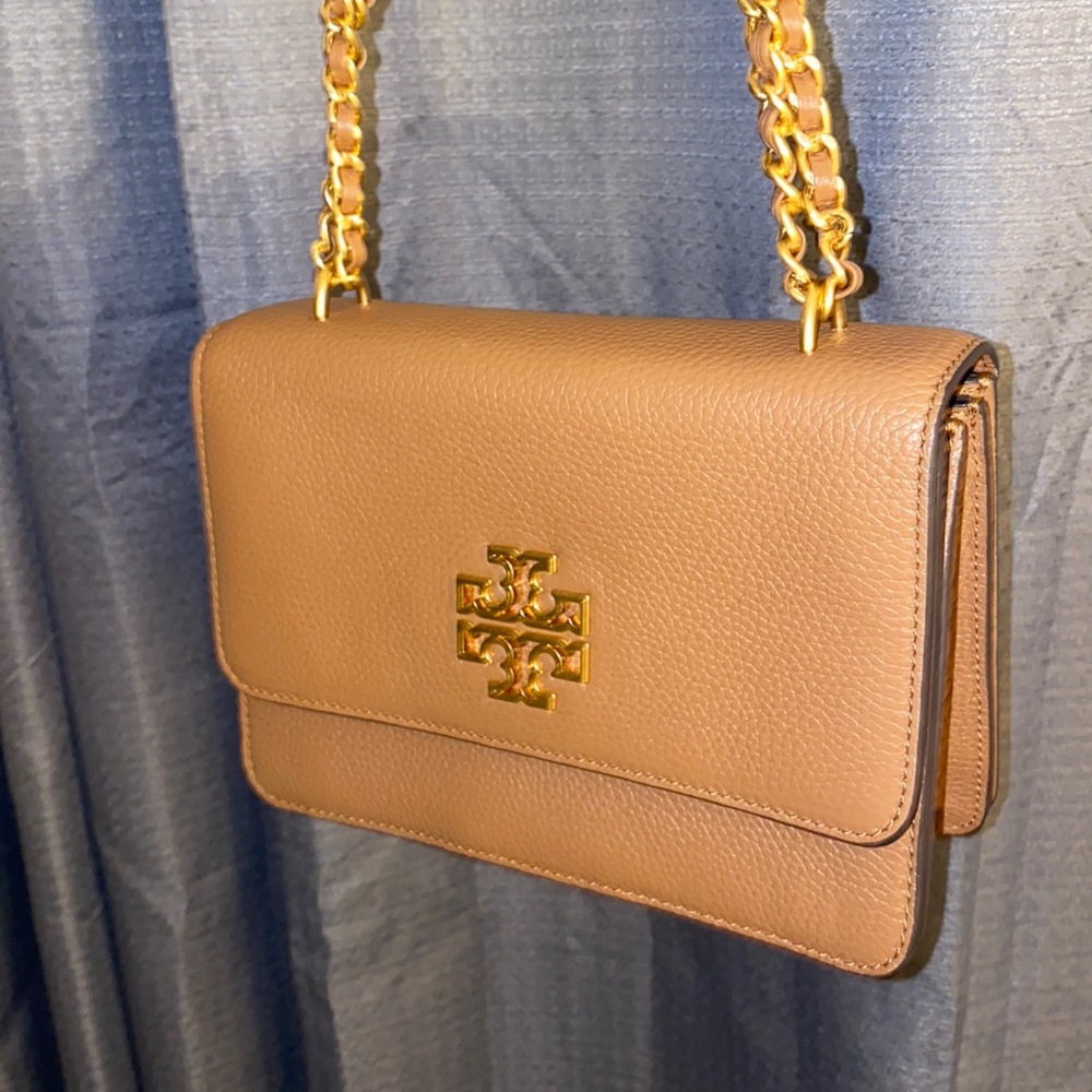Women’s brown Tori Burch bag